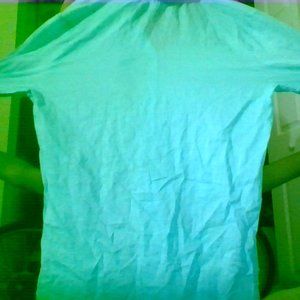 A thin bright blue blouse. Long sleeved.